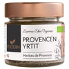 Foodin Luomu Provencen Yrtit (Herbes de Provence); lasipurkki ruusukultaisella metallisella kierrekannella, luomu/eko-merkintä ja viehättäviä yrttikuvituksia; lieriömäinen, läpinäkyvä purkki kuivattua yrttisekoitusta täynnä; paperietiketti mattapintainen, groteskifonttia, pientä lisätekstiä ja tyyliteltyjä kasvipiirroksia; vaalea tausta, ei ihmisiä.