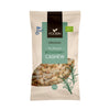 A beige bag of Foodin organic dry roasted rosemary cashews, 120g. The package has a matte finish and upright rectangular shape. Images of whole cashews and a sprig of rosemary are pictured on the front. Minimalist sans serif typography displays product name and weight. Certification and organic logos appear at the bottom. Plain background, no people present.