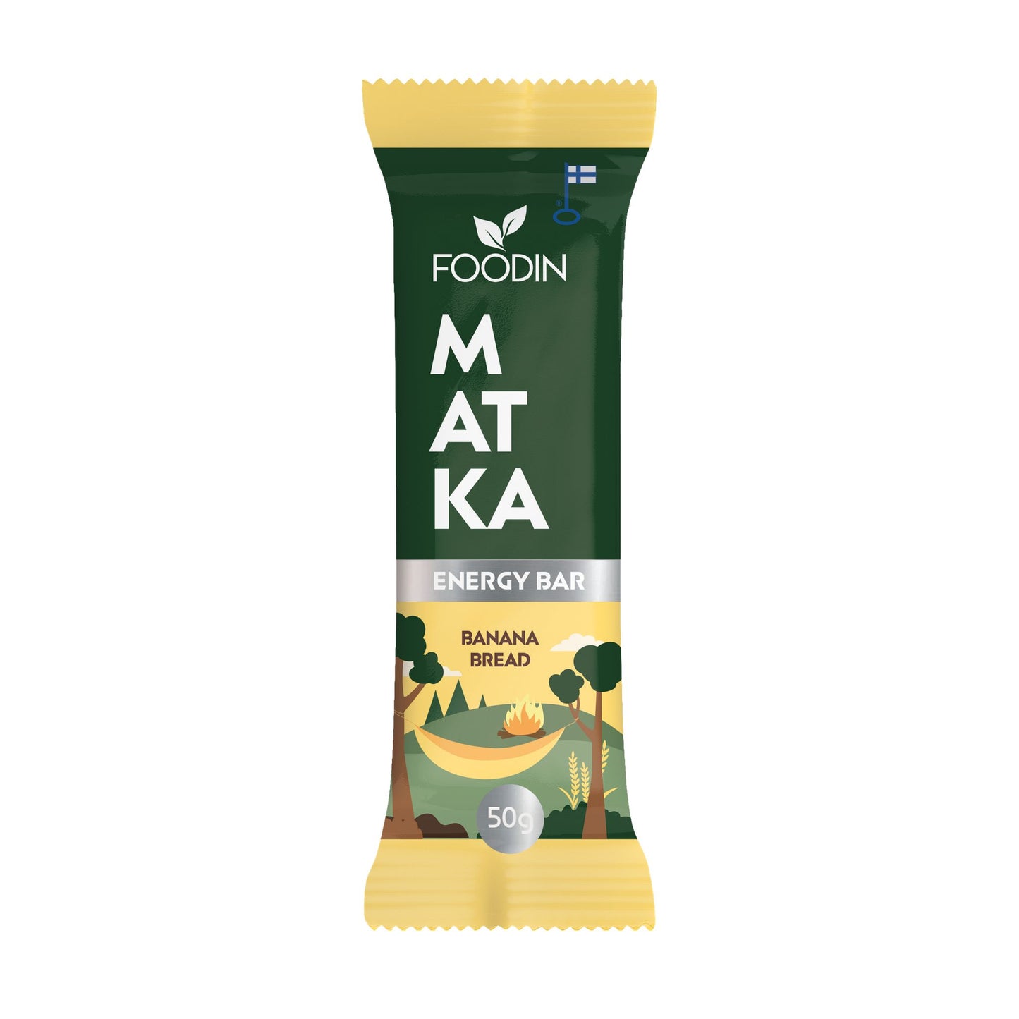 Foodin MATKA Energy Bar Banana Bread; Foodin Matka -energiapatukka banaanileivän maussa vihreässä ja keltaisessa mattapintaisessa kääreessä, kuvituksena puita ja nuotio; teksti selkeällä tikkukirjasimella; etiketissä lukee ”50g protein snack”; suorakaiteen muotoinen pakkaus ilman näkyvää läpinäkyvyyttä tai kiiltoa; tuote lepää tasaisella pinnalla ilman muita esineitä tai ihmisiä.