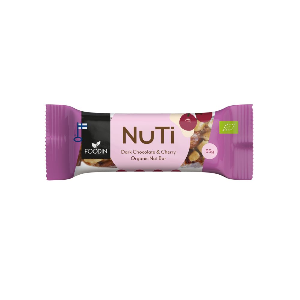A purple-wrapped Foodin NuTi bar, labeled Dark Chocolate & Cherry Organic Nut Bar, 35g. The wrapper is matte and rectangular. Printed images show cherries and mixed nuts. Organic and vegan certification icons are visible on the packaging. Text uses a mix of sans-serif fonts in white and dark colors. No people or hands are present, background is plain neutral.
