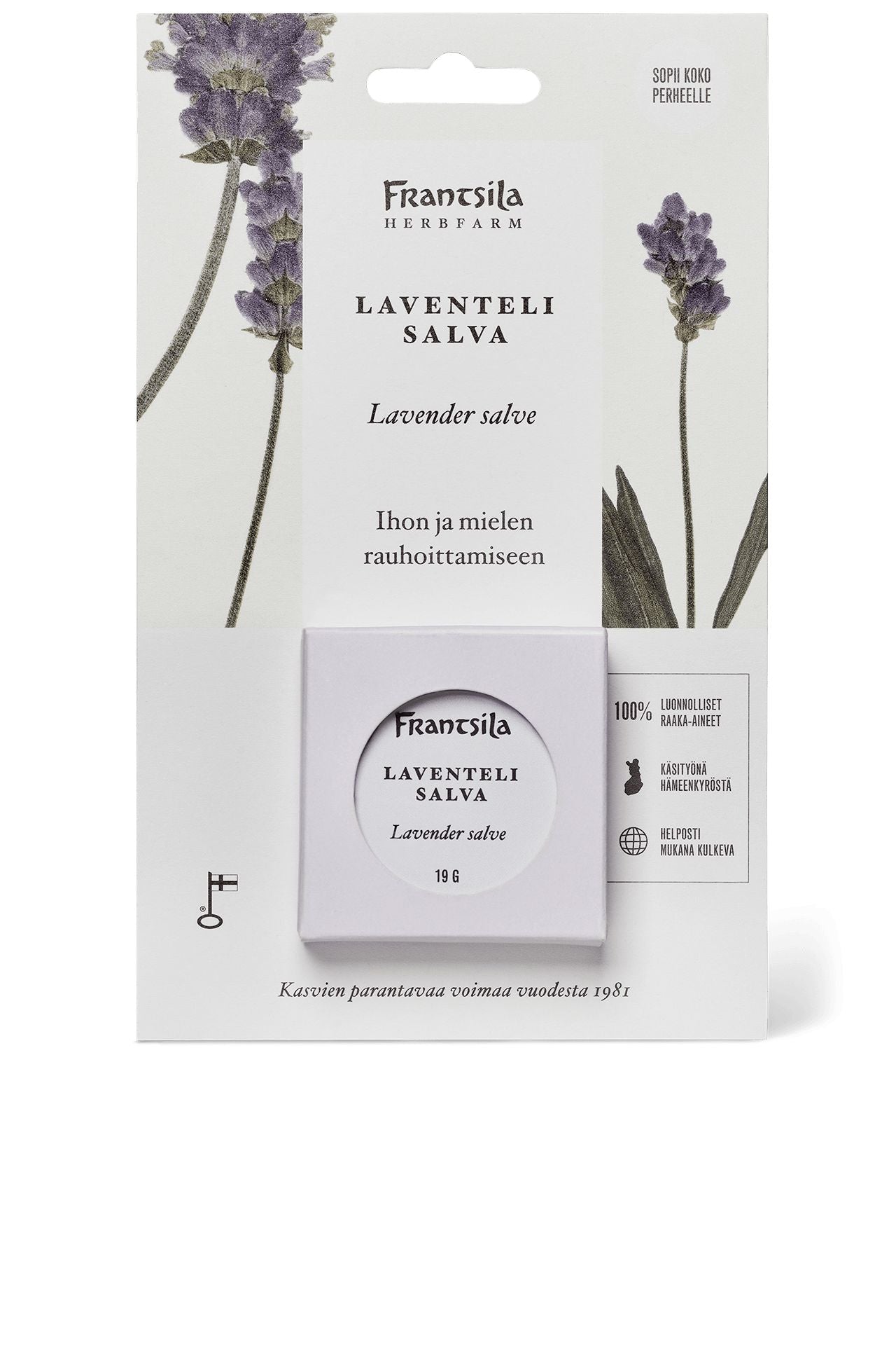 Front of a Fransila Lavender Salve package with purple lavender illustrations on a matte surface, product details in Finnish and English, and a circular transparent window showing the round metal salve tin inside. Packaging is rectangular cardboard. Serif and sans-serif fonts are used. Background is plain, no people or hands present.