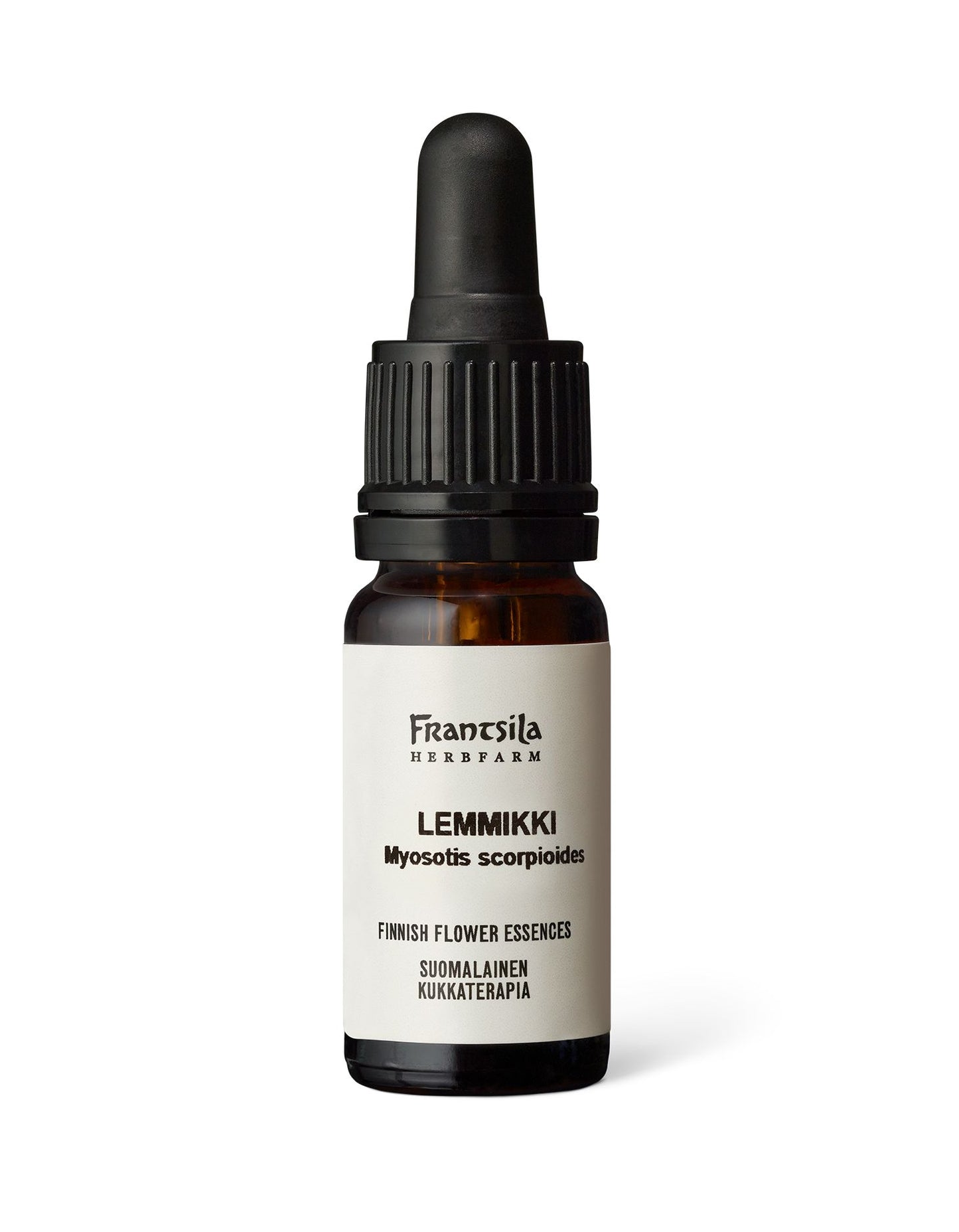 A small amber glass dropper bottle with a black plastic cap, matte finish, and cylindrical shape is centered on a plain, light-colored background. The white label features printed text in mixed serif and sans-serif fonts: “Frantsila Herb Farm Lemmikki (Myosotis scorpioides) Finnish flower essence.” No people or hands are visible in the frame.