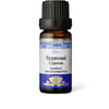 A small brown glass bottle labeled Aito Sypressi Cypress Essential Oil (Cupressus sempervirens). The bottle is cylindrical with a matte finish and topped with a ridged black plastic cap. The label is blue and white, rectangular, with clear black sans-serif text listing the ingredient. There are no people or hands, and the background is neutral.
