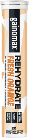 Gainomax Rehydrate Nesteytysporetabletti Fresh Orange -putkilo sisältää 20 poretablettia; lieriömäinen muoviputkilo mattapintaisella etiketillä oranssi-valkoisessa värimaailmassa ja lihavoidulla groteskikirjasimella; etiketti korostaa B12-vitamiinia ja sinkkiä pääraaka-aineina; tuote kuvattu yksinkertaisella taustalla ilman ihmisiä.