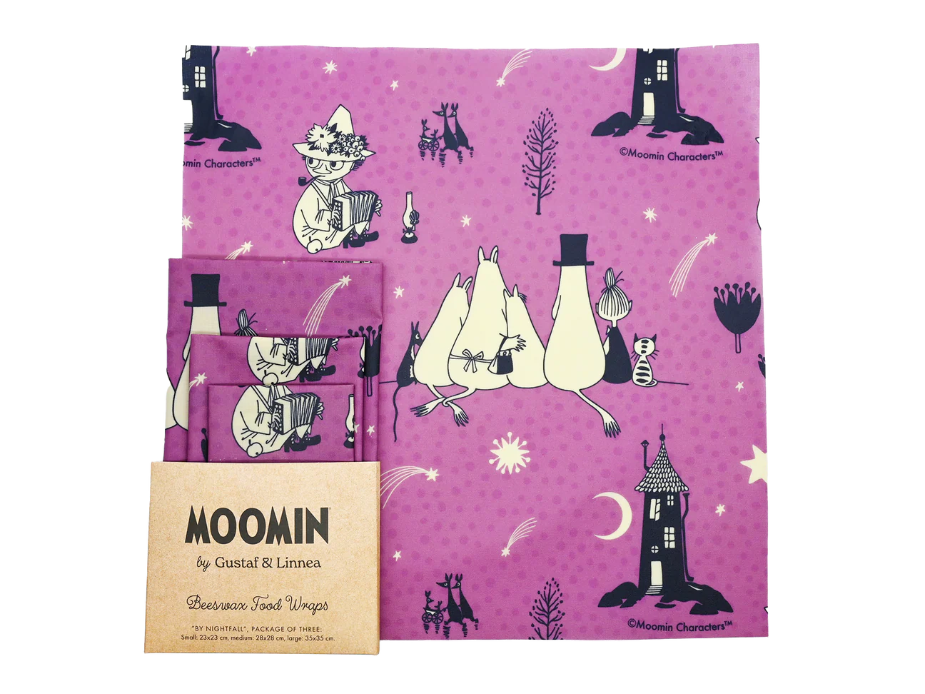 Three purple beeswax food wraps feature Moomin characters in whimsical scenes; the largest wrap shows three Moomins sitting together under stars, with two smaller wraps and packaging labeled MOOMIN by Gustaf & Linnea in the corner. Matte finish on all wraps, square shapes, printed surface. Packaging is paper with clear text and illustration accents. Product rests on a flat neutral background. These eco-friendly wraps add a charming touch to any kitchen.