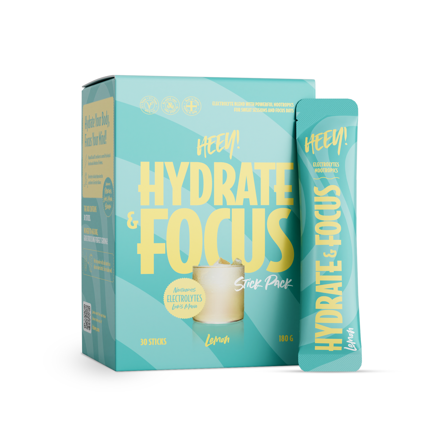 Heey! Hydrate & Focus Electrolytes, maku Lemon; pakkaus ja yksittäinen tikkupussi Hey! Hydrate & Focus -elektrolyyttijauhetta sitruunan maulla; pakkaus turkoosi mattapinnalla, lihavoitua keltaista tekstiä ja kuva lasista sitruunaviipaleineen laatikon kannessa; molemmissa painettu tuotenimi ja maku; vaalea tausta, ei ihmisiä tai käsiä kuvassa.