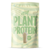 Heey! Plant Protein, maku Vanilla-Pear; vaaleanvihreä pussi tekstillä HEEY! PLANT PROTEIN, kuva vanilja-päärynäshakesta pillin kera; mattapintainen joustava materiaali, suorakaiteen muotoinen pohja, lämpösaumatut reunat; lihavoitu groteskityypografia valkoisena ja mustana; etuteksti mainitsee 85 % kasviproteiinia, B12-vitamiinia ja 500 g; ei ihmisiä tai käsiä; vaalea tausta, tuote pystyssä suoraviivaisessa studiokuvassa.