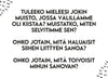 Rectangular print or sign with black text on a white matte background; the corners feature abstract black shapes. The type is simple and readable. No packaging or product branding visible. Legible text: Musta teksti valkoisella taustalla, kulmissa abstrakteja mustia muotoja. Teksti kysyy muistosta, johon liittyy konflikti: mitä toinen haluaisi siitä kertoa ja mitä hän toivoo kuulevansa sinulta. No people or actions present in the image.
