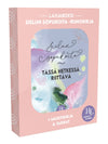 Pink gift box featuring the Finnish book Sielun sopukoita, adorned with abstract watercolor art and elegant white script text, includes a notebook and charming stickers inside. The rectangular box has a smooth matte finish and is closed. The book cover shows fluid shapes in pastel tones and legible white handwriting-style title. Items are arranged on a plain background under diffused lighting. No people or hands are visible in the shot.