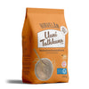 An orange 750g package of Hirvielän Uuni Talkkuna, a traditional Finnish oat flour made from quality oats. The surface is matte with squared sides and sealed top. The front features a color photo of a bowl containing the product and a metal spoon. Black and white text on the label lists ingredients and certification details in clear sans-serif type. The background is plain white and there are no people or hands visible. The image is shot straight-on at eye level.