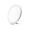 A round, white LED therapy lamp with a thin frame, shown propped up on a small stand against a plain white background. Surface is matte with no visible texture or gloss. No visible packaging. No text or branding on the product itself. Background is evenly lit with no shadows or props, and there are no people present in the image.