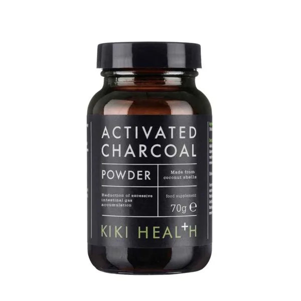 A dark, cylindrical glass jar with a glossy finish contains 70 grams of product and is labeled “Activated Charcoal Powder by Kiki Health.” The white sans-serif text on a black background indicates it’s made from coconut shells and used to reduce excessive intestinal gas. The surface is smooth. Photo shows only the jar against a plain, light backdrop. A dark glass jar labeled Activated Charcoal Powder by Kiki Health. The 70g jar notes it is made from coconut shells and contains finely milled charcoal used