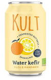 A yellow can of Kult Water Kefir Yuzu & Mandarin, featuring images of an orange and a lemon, with text highlighting low sugar, fermented goodness, and sparkling probiotics. Cylindrical metal can with a matte finish. Main text in bold sans-serif font; accent fonts used for flavor and health claims. Plain studio background, no people or actions visible. Front-facing product shot showing the entire label.