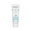 A tube of Lavera Basis Sensitiv Hand Cream, featuring organic aloe vera and shea butter. The white, matte-finish plastic tube is upright with a rounded flip cap. Label text in English and Italian covers the front, with several certification logos. Sans-serif font is used for product details. The background is plain and evenly lit with no people or props visible.