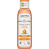 A bottle of Lavera Naturkosmetik Revitalising Body Wash with organic orange and mint. The plastic bottle has a white body, a green flip-top cap, and a semi-gloss finish. The front label shows an orange slice and mint leaves image. Text on the label notes “protects skin flora,” “vegan,” and “climate-neutral.” No people or hands are visible. The background is plain white.