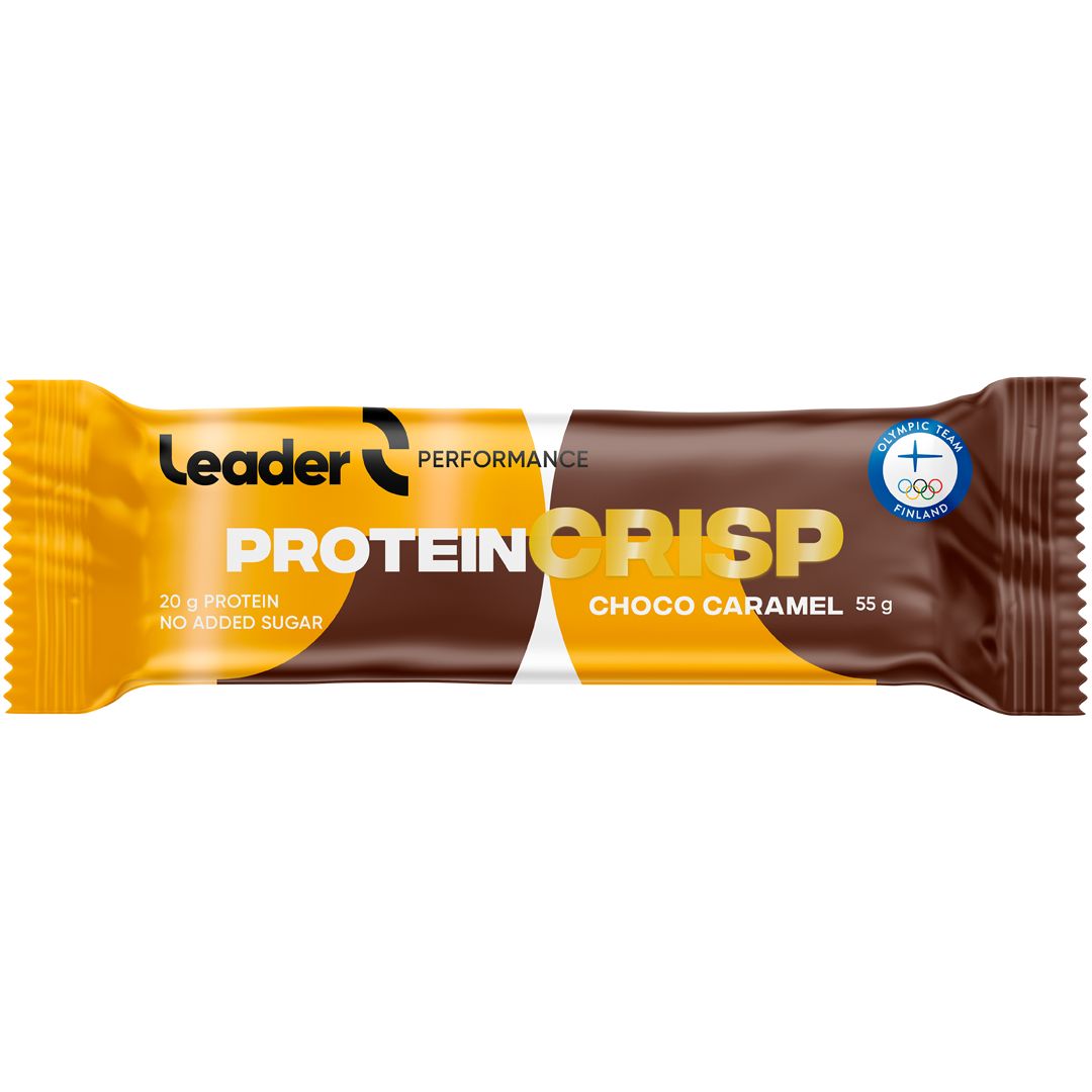 Leader Performance Protein Crisp Choco Caramel; Leader Protein Crisp Choco Caramel -patukka keltaisessa ja ruskeassa kiiltäväpintaisessa pakkauksessa, suorakaiteen muotoinen kierretyin päin, kuvattuna tasaisella taustalla; etiketissä ”20g protein”, ”no added sugar” ja ”55g”; tekstissä mainitaan klassinen maku sekä maininta Team Finlandin virallisesta välipalasta; kuva keskittyy pelkkään tuotteeseen, ei ihmisiä tai käsiä näkyvissä.