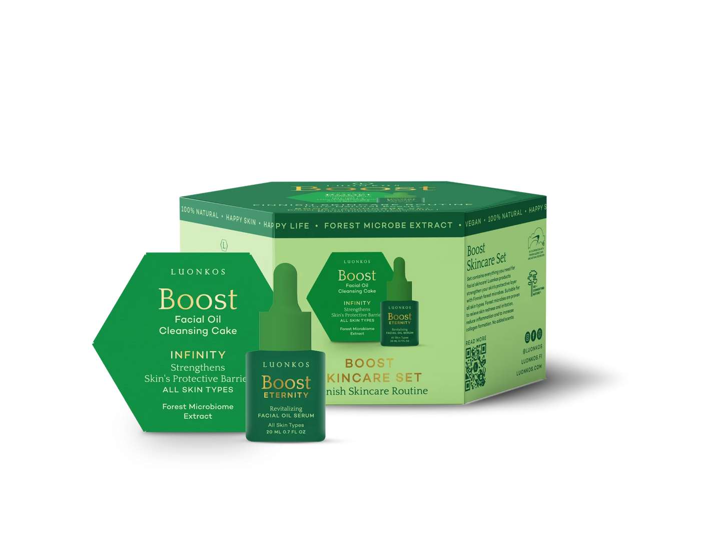 Vihreä ja valkoinen Luonkos Boost Skincare Set -pakkaus, jossa kuusikulmainen mattapintainen saippua ja pieni lasinen tippapullo, molemmat aseteltuina pystyssä rasian eteen; molemmissa etiketeissä tuotenimi, käyttö ihon suojan tueksi ja maininta metsämikrobiuutteesta; typografia modernia groteskia tummalla värillä; saumaton vaalea tausta, ei ihmisiä tai käsiä näkyvissä; laaja tuotekuva edestä.