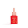 Pieni punainen Luonkos Glow Glory Illuminating Facial Oil Serum -pullo vaaleanpunaisella pipettikorkilla seisoo pystyssä valkoisella taustalla; pullo lieriömäinen mattapinnalla; etiketissä yksinkertaista groteskikirjasinta tuotenimelle; ei ihmisiä tai käsiä näkyvissä tässä studiokuvassa.