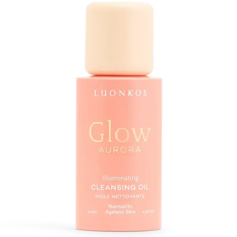Luonkos Glow Aurora Cleansing Oil; persikanvärinen pullo Luonkos Glow Aurora Illuminating Cleansing Oil -puhdistusöljyä normaalille tai ikääntymättömälle iholle, minimalistinen tekstisuunnittelu ja vastaava kansi; pullo lieriömäinen mattapinnalla; luettava etikettiteksti sisältää tuotenimen ja ihotyypin; tausta yksinkertainen, ei ihmisiä tai käsiä kuvassa.