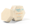 Luonkos Hydrate Essence Hand & Body Soap; kuusikulmainen saippuapala esillä yhteensopivan kuusikulmaisen rasian edessä, tekstillä ”Hydrate Essence Hand & Body Soap, Cleansing, Dry to Sensitive Skin, Fragrance Free” valmistaja Luonkos; saippua mattapintainen ja neutraalinvärinen; rasiassa tikkukirjasintypografiaa mustana vaalealla pohjalla; ei ihmisiä tai käsiä näkyvissä; kuvausympäristö neutraali ja pelkistetty tasaisessa valaistuksessa.