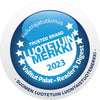 Pyöreä sininen ja valkoinen tunnusmerkki, jossa lukee "Trusted Brand LUOTETUIN MERKKI 2023" tähtien kera, "Valitut Palat – Readers Digest" sekä suomenkielistä tekstiä reunoilla korostaen luotettavuutta; tekstausvapaita fontteja käytetty suuraakkosin ja pienaakkosin sekaisin, osa lihavoituna; tunnuksen viimeistely mattamainen ilman näkyvää pakkausta tai taustaympäristöä; ei ihmisiä tai käsiä näkyvissä.