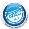 A.Vogel MenoSupport 40+; pyöreä sininen-valkoinen tunnusmerkki, jossa tähtiä ja teksti "Trusted Brand 2023" sekä suomen- ja englanninkielistä tekstiä luotettavasta luonnontuotemerkistä (Reader's Digest -tunnustus); merkin pinta mattaa, fontti groteski, keskellä lihavoitua tekstiä; tausta valkoinen, kuva läheltä pelkästä merkistä, ei muita esineitä eikä ihmisiä.