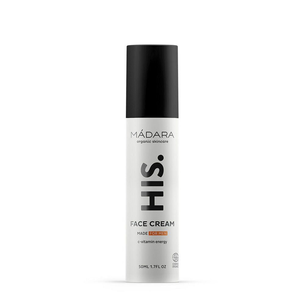 Madara HIS Face Cream; valkoinen pullo luomuihonhoitoa, mustalla korkilla, merkitty miehille, sisältää vitamiinienergiaa, 50 ml:n koko; sylinterinmuotoinen, mattapintainen; etiketissä lihavoitua mustaa groteskitekstiä; ei ihmisiä tai käsiä näkyvissä; yksivärinen tausta, kuva suoraan edestä etikettitekstin selvästi näkyen.