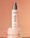 Madara SOS Hydra Cream -pullo vaaleanpunaisen kiven päällä