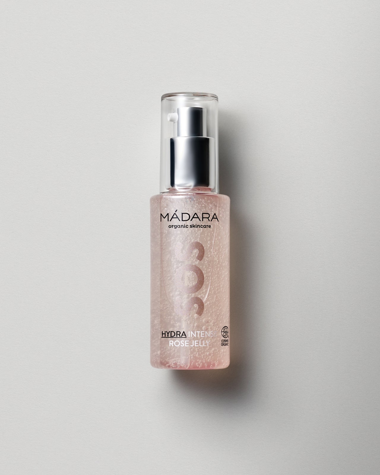 Madara SOS Hydra Intense Rose Jelly vaaleanpunaisessa pullossa harmaalla taustalla
