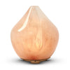 Made by Zen Gem Diffuuseri; persikanvärinen lasinen eteerisen öljyn diffuusori pisaranmuotoisena ja pyöristettynä, pinta kiiltävä ja marmoroitu, pieni puinen jalusta; ei näkyviä etikettejä tai tekstiä; tuote kuvattu yksin yksivärisellä taustalla ilman ihmisiä tai käsiä.