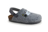 Gray felt clog slipper with a back strap and cork sole, featuring playful cartoon characters on the upper part for added charm. The surface is matte, the slipper has a rounded toe and exposed stitching along the sole edge. No packaging is visible. Upper displays colorful printed graphics; no legible text appears. Plain white background, product photographed from a side view with no people or hands shown.