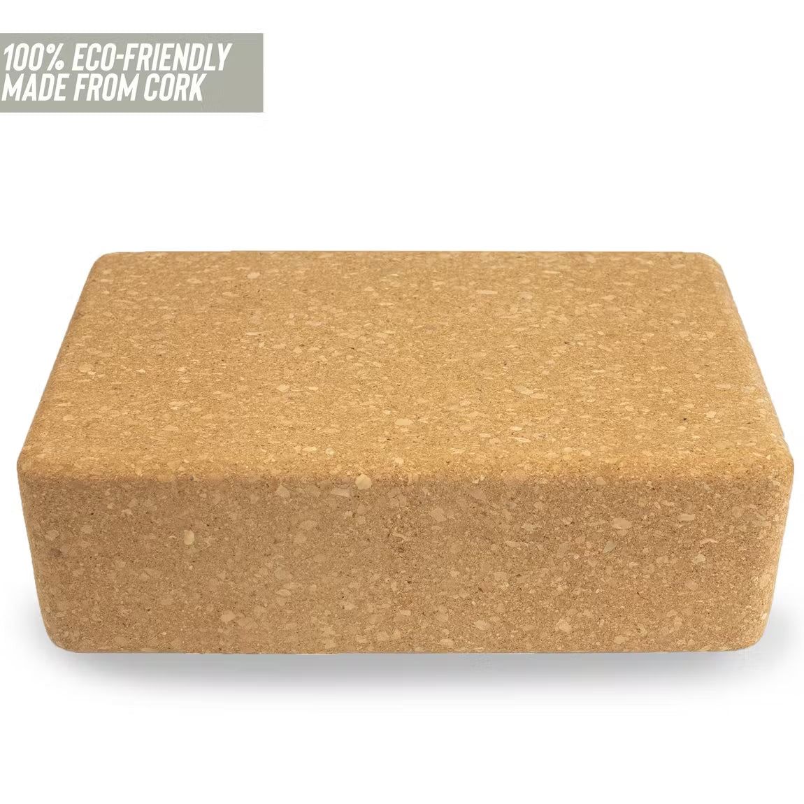 A rectangular cork yoga block is shown against a white background. The block is light brown with a matte surface and visible cork texture. There is no packaging. In the top left corner, text in thin, all-caps font reads 100% eco-friendly, made from sustainable cork. No people or hands are present in the image. Shot is direct and product-focused.