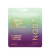 A packet labeled Forest Elixir Microbiome Skincare Microbiome Balancing Sheet Mask by NOBE, featuring a green and purple gradient background with gold text and microbiome-balancing benefits. The packaging is rectangular and made of glossy material. The font for the main label is bold and metallic, with smaller supporting text beneath. No people or hands are visible, product photographed against a plain backdrop.