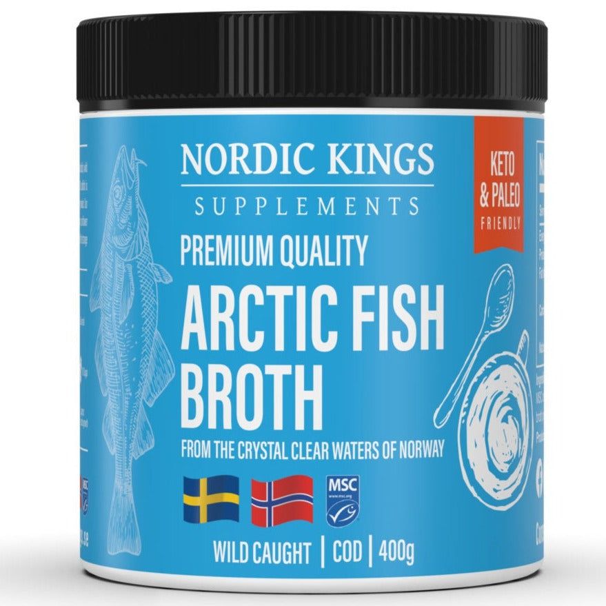 A container of Nordic Kings Arctic Fish Broth with blue label, fish illustration, and text highlighting its wild-caught cod, keto and paleo friendly qualities from Norway. The packaging features Swedish and Norwegian flags and contains 400g. The plastic container is cylindrical with a clear body and blue matte-finish lid. Sans-serif fonts are used for main label text. The product is photographed against a white background with even lighting; no people or hands are present in the shot.