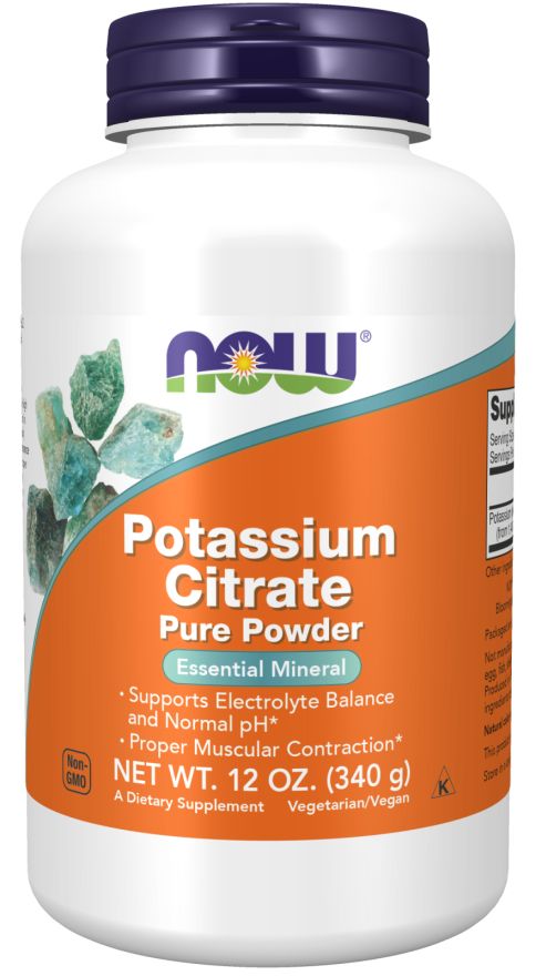 A white plastic bottle of NOW brand Potassium Citrate Pure Powder with a matte finish and orange label. The bottle is cylindrical with a screw cap. The label has blue-green crystal graphics, bold sans-serif typography, and includes text such as “essential mineral,” “electrolyte balance,” and “muscle contraction.” Neutral studio background, no people present.