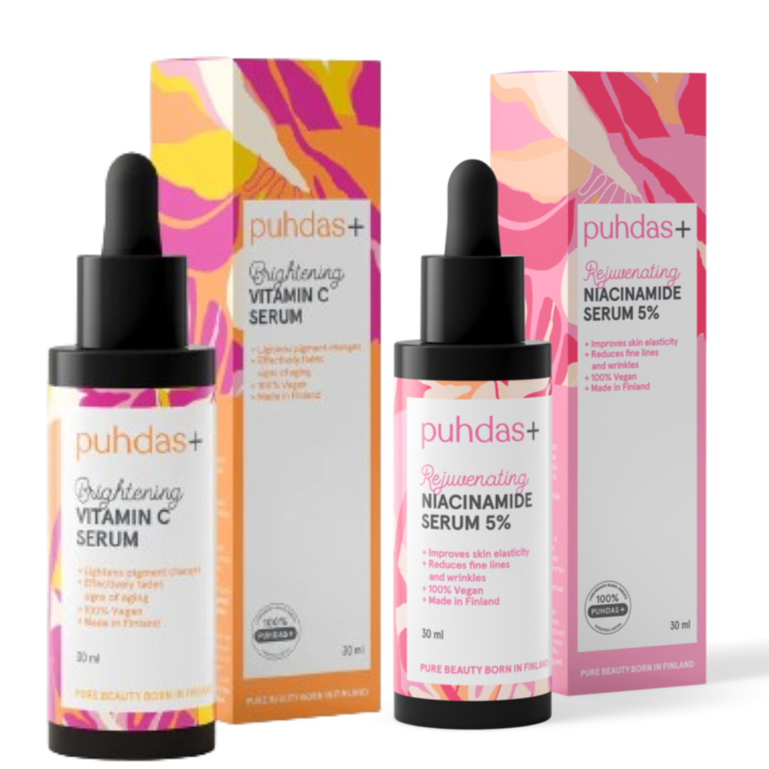 Puhdas Lahjapakkaus Niacinamide Serum & Vitamin C Serum; kaksi tippapullollista ja vastaavat pakkaukset merkittynä puhdas+; tuotteet Brightening Vitamin C Serum ja Rejuvenating Niacinamide Serum 5 %; molemmissa eloisia vaaleanpunaisia, keltaisia ja persikansävyisiä abstrakteja muotoja; pullot lieriömäisiä valkoisin kansin ja tippoin; etiketeissä modernia mustaa groteskifonttia; valkoinen tausta, kuvattu edestä ilman ihmisiä tai käsiä.