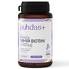 A bottle of Puhdas+ Beauty Vahva Biotiini 5,000 µg supplement with a purple and white label, highlighting its vegan formula and containing 60 capsules for beauty support. The container is cylindrical with a matte white plastic body and screw-on cap. The label features sans-serif text in purple and black. No people or hands are present. Background is plain white. Studio product shot, straight-on angle.