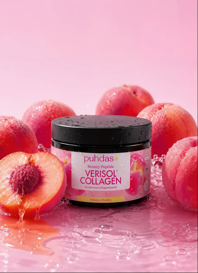 Puhdas+ Verisol Collagen Valkoinen Persikka -purkki tuoreiden persikoiden ympäröimänä