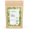 A brown resealable pouch labeled puhdas+ with a green leaf design contains 300g of hemp seeds. Matte finish, rectangular shape with a flat base. Bold white and green modern sans-serif fonts used for labeling. Label text mentions Omega-3, protein content, gluten-free benefits, and Finnish origin. Pouch is photographed against a plain white background, product centered in frame. No people or hands are visible.