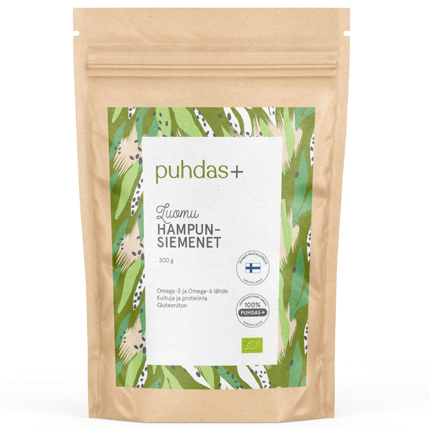 A brown resealable pouch labeled puhdas+ with a green leaf design contains 300g of hemp seeds. Matte finish, rectangular shape with a flat base. Bold white and green modern sans-serif fonts used for labeling. Label text mentions Omega-3, protein content, gluten-free benefits, and Finnish origin. Pouch is photographed against a plain white background, product centered in frame. No people or hands are visible.