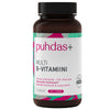 A brown bottle of puhdas+ MULTI B-VITAMIINI vegan supplement with a white label featuring pink and green accents and Finnish text about essential B vitamins. The bottle has a matte finish and cylindrical shape. The label displays bold sans-serif typography for the brand name and product information. The background is plain white, with no visible people, hands, or props in the image. This is a straightforward product shot showing only the supplement bottle.
