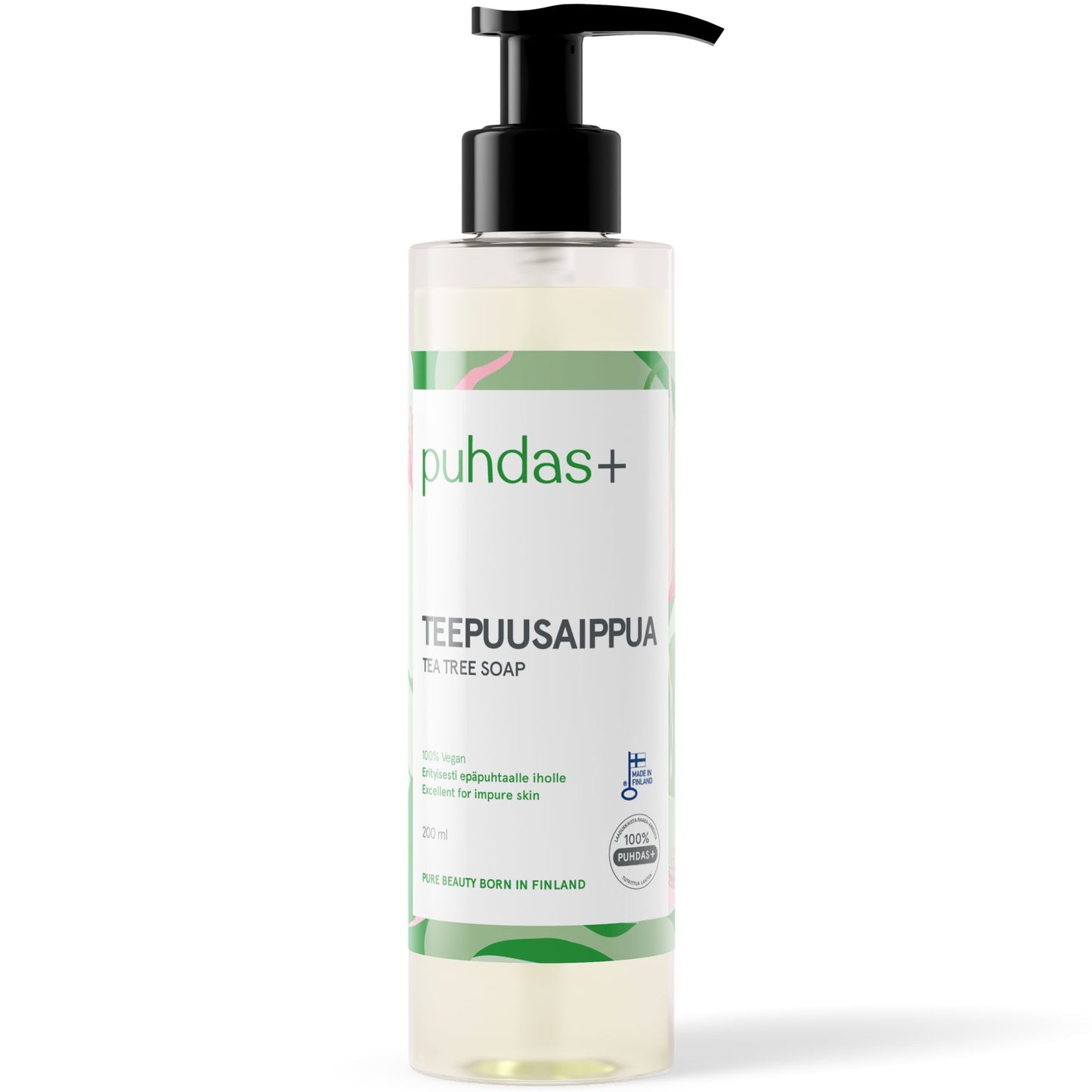 A clear bottle with a black pump dispenser, labeled puhdas+ TEEPUUSAIPPUA TEA TREE SOAP. The white, rectangular label has green accents and black sans-serif text, listing ingredients and mentions of tea tree, impure skin, and Finland. The bottle appears plastic with a cylindrical shape and glossy finish. No people or hands present; plain background.