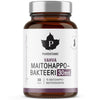 A brown glass bottle with a black matte cap is shown. The white and purple label displays bold sans serif text, “Puhdistamo Vahva Maitohappobakteeri 30 mrd,” and has a maple leaf logo. Surface of the bottle is glossy. No people or hands are present. Plain white background, product centered in frame. A brown glass bottle labeled Puhdistamo Vahva Maitohappobakteeri 30 mrd contains 30 capsules with 15 strains of lactic acid bacteria. Featuring a white and purple label, black cap, maple leaf logo, this