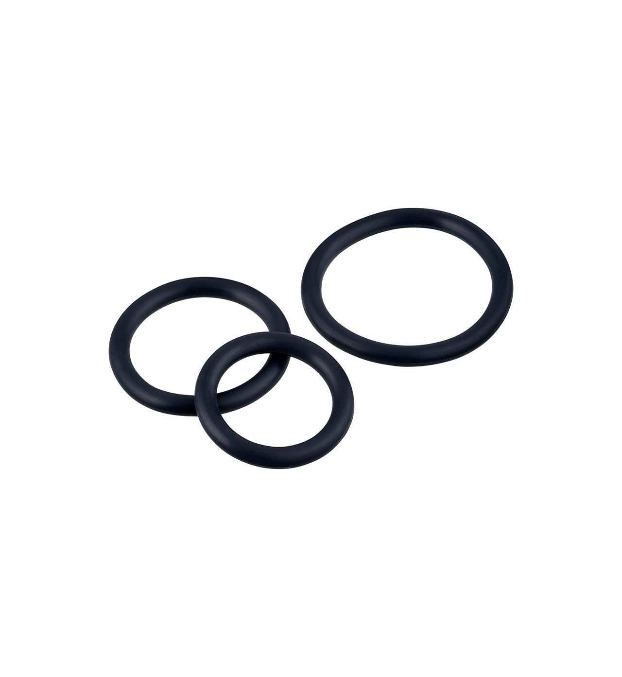 Three black rubber O-rings of different sizes rest separated on a plain white background. Each O-ring has a matte finish and a smooth texture. The objects are circular and unmarked, with no packaging present. There is no typography, setting context, or people shown in the image.
