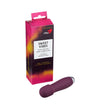A purple mini vibrator with a smooth, matte finish and rounded shape lies beside a pink and black cardboard product box. The box displays bold white text for the brand “Sweet Vibes” and mentions “Silk Touch Mini Vibrator” as well as “7 vibration modes.” No people or hands are present. Neutral background. A purple mini vibrator lies next to a pink and black Sweet Vibes product box featuring the Silk Touch Mini Vibrator with 7 vibration modes for pleasure.