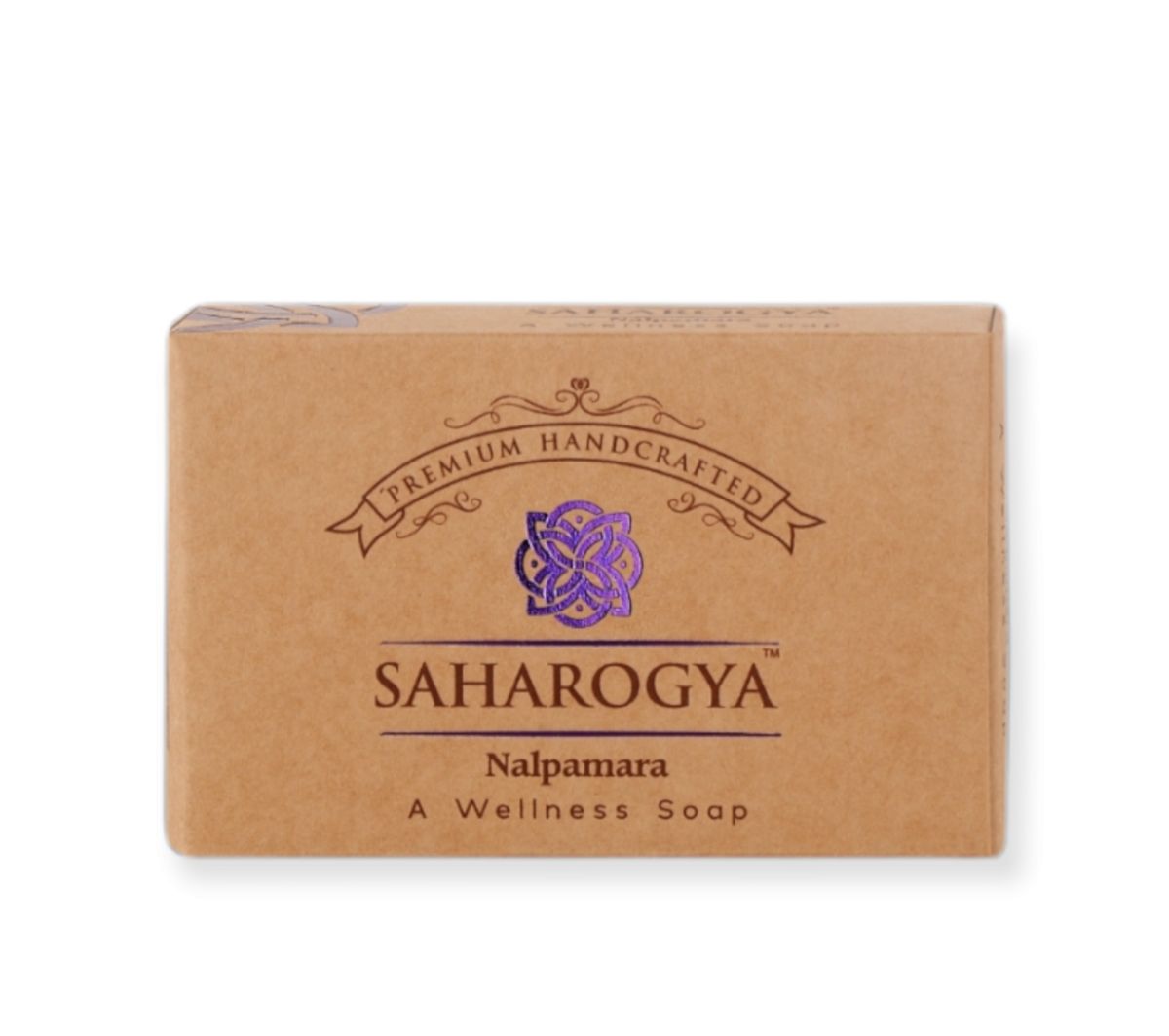 A brown, rectangular cardboard box with a matte surface. Packaging shows centered serif and sans-serif text in purple and brown, along with a decorative emblem above the product name. Label reads: Saharogya Nalpamaram - A Wellness Soap; Premium Handcrafted above in colored text. No people or hands visible; plain background; standard product photo shot.
