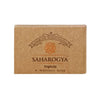A brown, rectangular cardboard box with a matte finish, labeled Saharogya Triphala Wellness Soap. “Premium Handcrafted” is printed above the product name in a simple sans-serif font. The packaging shows clear corners and edges, with all text aligned horizontally. The box is displayed on an untextured light background in a standard product shot.