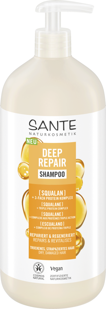 Sante Deep Repair Shampoo; pullo skvalaanishampoota, kuvassa kultaisia kuplia ja valkoista tekstiä; pullo on sylinterinmuotoinen muovia mattapinnalla, mustalla pumppuannostelijalla; etikettitypografia on pääosin valkoista groteskia; tekstissä mainitaan vegaanisuus ja sopivuus kuiville, vaurioituneille hiuksille; tausta vaalea, ei ihmisiä näkyvissä.