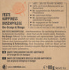 Label for a solid shower bar called Feste Happiness Duschpflege with Bio-Orange & Mango, showcasing product features, usage directions, and certifications in German, French, and Italian. Contains 80g. Includes natural cosmetic details and highlights the refreshing qualities of mango. Rectangular paper packaging with matte finish; main colors are yellow and white; bold sans-serif typeface is used for headings and key info; compact layout groups text blocks by language; no people or hands visible;