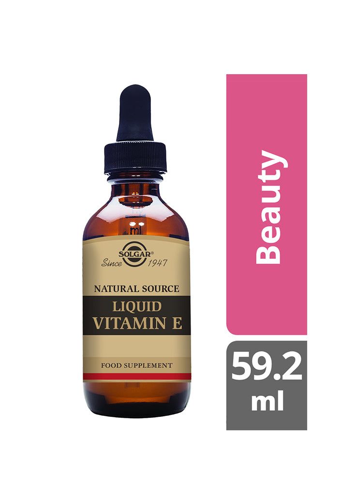 Solgar E-vitamiini nestemäinen -pullo, meripihkanvärinen lasi, tippakorkki, kultainen-ruskea etiketti; 59,2 ml, vieressä vaaleanpunainen laatikko tekstillä "Beauty Box"